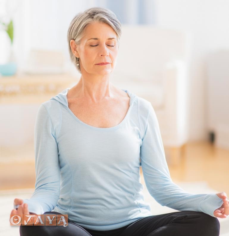 Woman practices OJAYA anti-aging meditation method