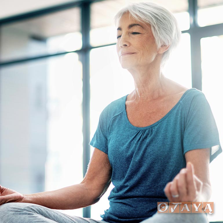 Elderly Japanese woman meditates to sleep well at night