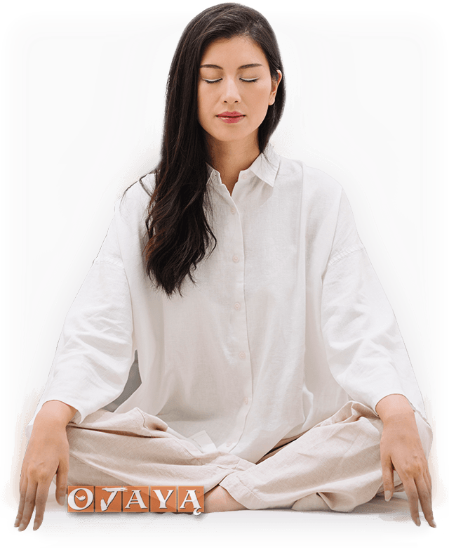 Blissful OJAYA Young Woman in White Deeply blissful Asian woman meditates with OJAYA technique.