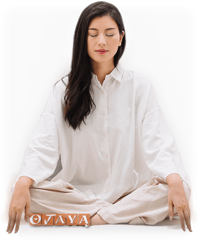 Deeply blissful Asian woman meditates with OJAYA technique.